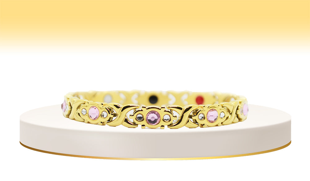 Main view of 'THE JULIETTE' Women’s Gold Pink Crystallized Filigree Bracelet, a harmonious blend of elegance and glamour. This enchanting bracelet features meticulously crafted filigree links adorned with sparkling pink crystals, creating a captivating and timeless accessory that radiates sophistication.