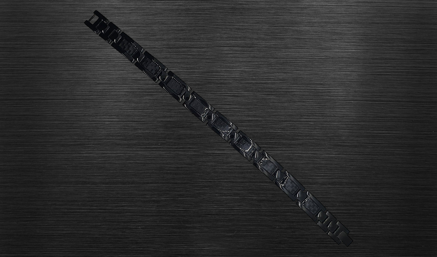 Front view of 'THE ETHAN' Men's Black Carbon Brick Bracelet, highlighting the geometric link design that contributes to the bracelet's ultra-modern aesthetic. Crafted for both powerful functionality and style, this perspective emphasizes the sleek and stylish setting of 'THE ETHAN'.