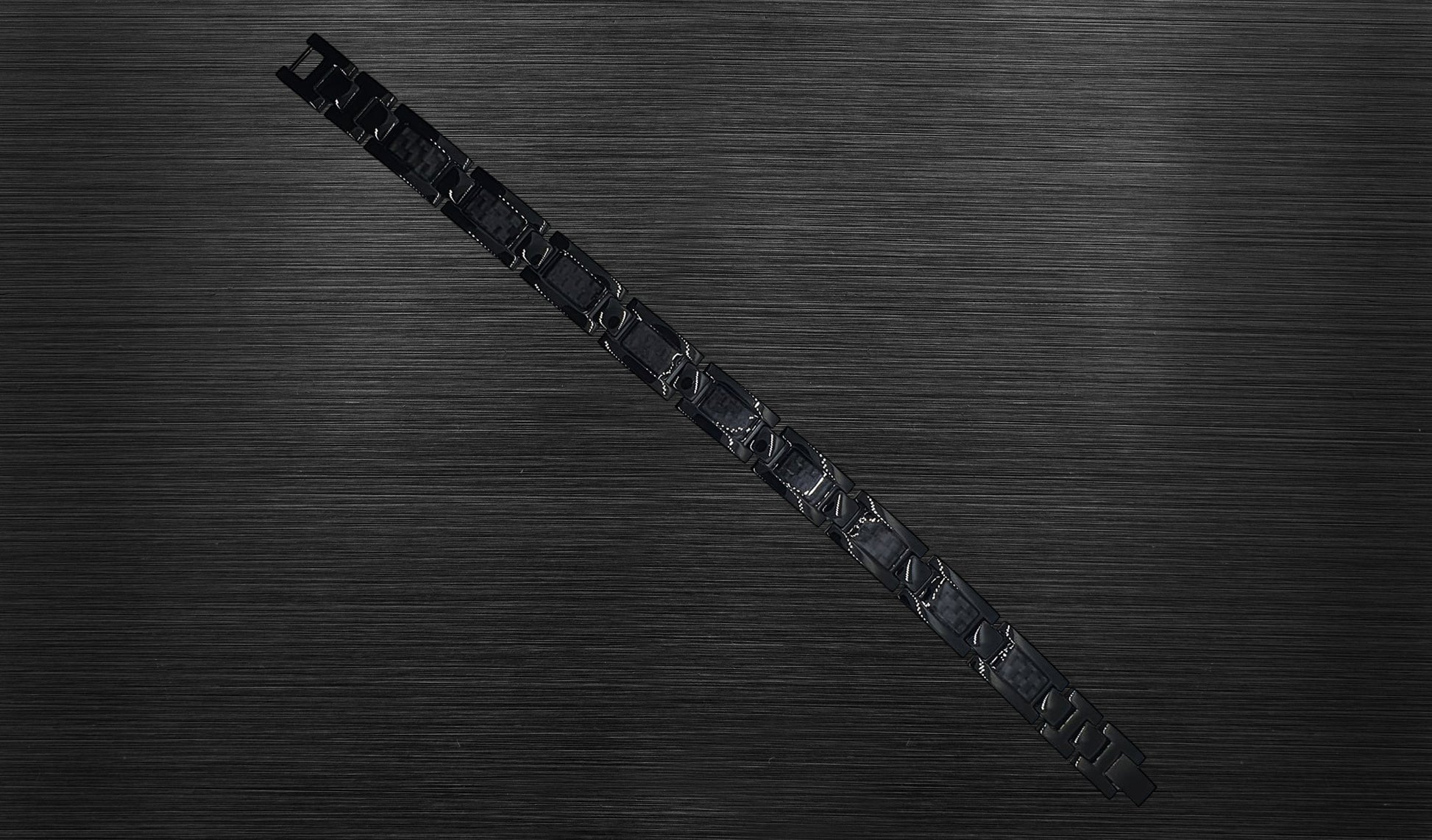 Front view of 'THE ETHAN' Men's Black Carbon Brick Bracelet, highlighting the geometric link design that contributes to the bracelet's ultra-modern aesthetic. Crafted for both powerful functionality and style, this perspective emphasizes the sleek and stylish setting of 'THE ETHAN'.