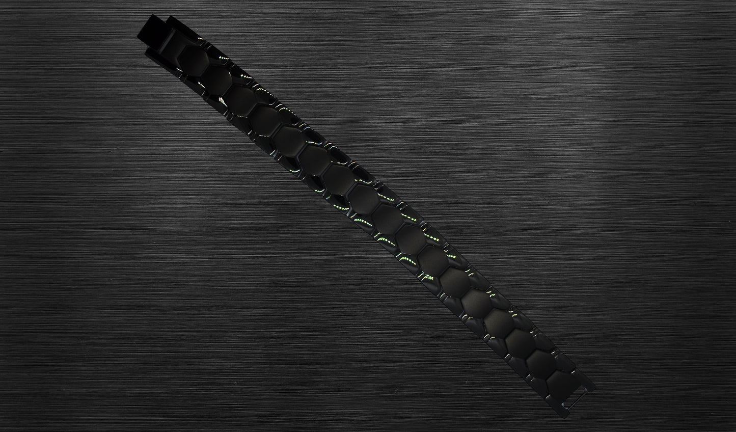 The front view of 'THE CARLISLE' allows you to appreciate the intricate details of its matte geometric shapes and shiny classic track design. The rich black color enhances the bracelet's overall aesthetic appeal, making it a refined and elegant choice for the modern man. This view emphasizes the uniqueness and sophistication that 'THE CARLISLE' brings to your wrist.