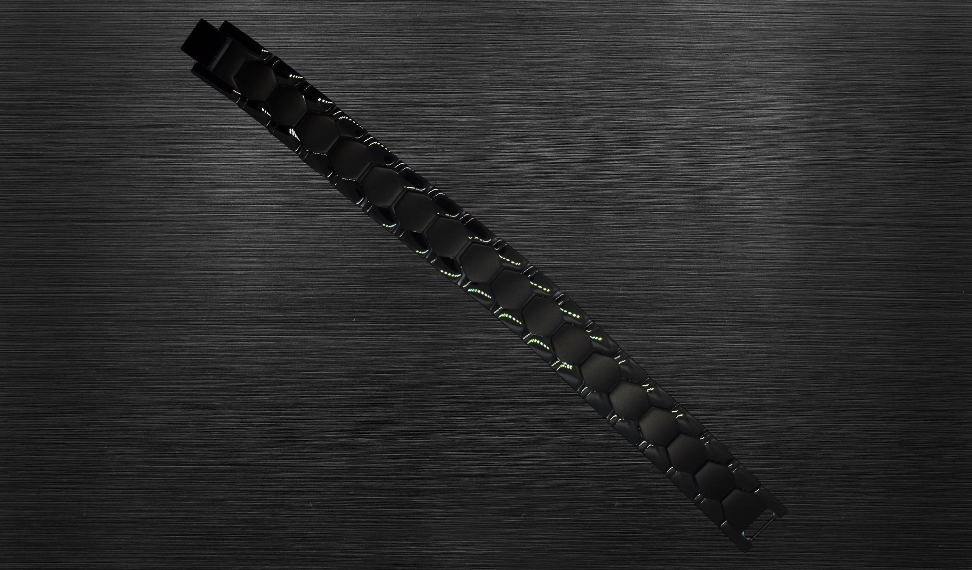 The front view of 'THE CARLISLE' allows you to appreciate the intricate details of its matte geometric shapes and shiny classic track design. The rich black color enhances the bracelet's overall aesthetic appeal, making it a refined and elegant choice for the modern man. This view emphasizes the uniqueness and sophistication that 'THE CARLISLE' brings to your wrist.