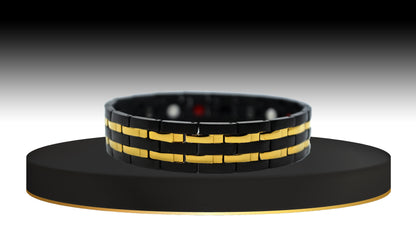 Immerse yourself in 'THE HENRY,' a Men's Black/Gold Double Trim Bracelet designed for a unique fusion of healing properties and modern style. The main view introduces you to its innovative design, where geometric gold-trimmed links seamlessly blend with modern technology. 'THE HENRY' offers not only a stylish accessory but also immune system support and increased blood circulation, providing a holistic approach to your well-being.