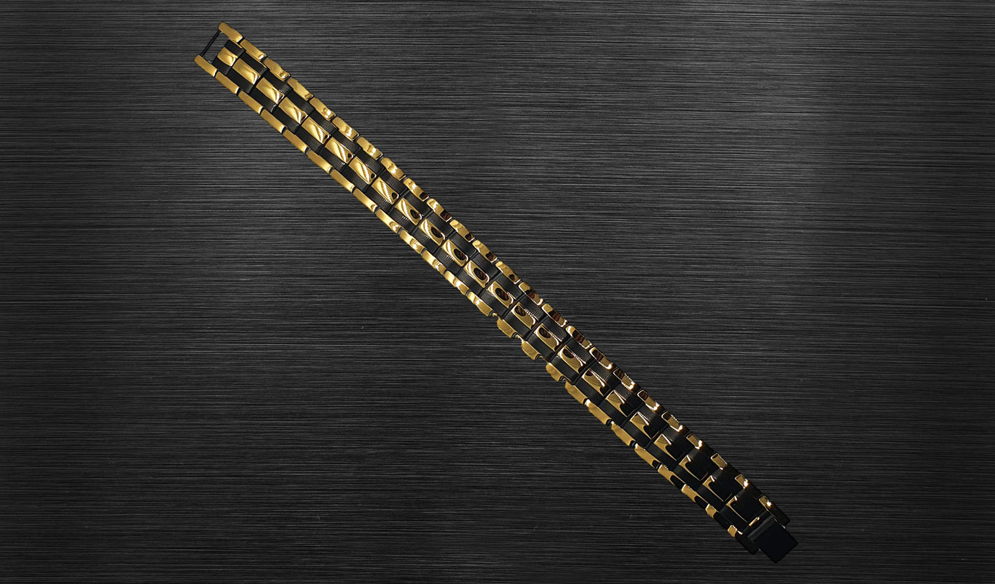 The front view of 'THE AUSTIN' allows you to appreciate the intricate details of its design. The combination of rich gold and durable black track links creates a visually captivating contrast, highlighting the bracelet's contemporary and sophisticated appeal. This view emphasizes the bold aesthetic that 'THE AUSTIN' brings to your wrist, making it a statement piece for various occasions.