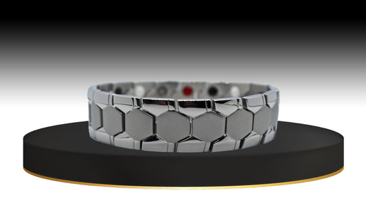 Introducing 'THE ADAM,' a Men's Silver Geometric Brick Bracelet that seamlessly blends style and functionality. The main view showcases its distinctive matte geometric and shiny watch design, making a stylish statement on your wrist. Beyond its aesthetic appeal, 'THE ADAM' is crafted with special meaning and prestige, offering immune system support and anxiety reduction with each wear.