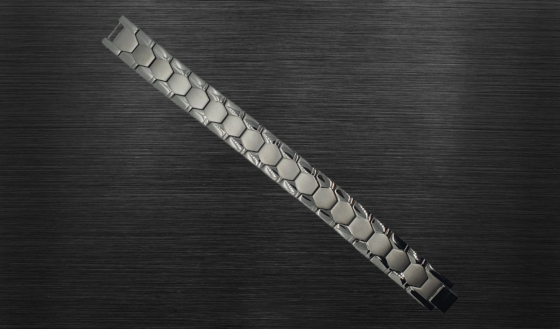 The front view of 'THE ADAM' allows you to appreciate the exquisite details of its matte geometric and shiny watch design. The combination of silver and the thoughtful arrangement of links creates a handsome and stylish accessory. This view emphasizes the bracelet's contemporary and meaningful design, making it a standout piece for the modern man.