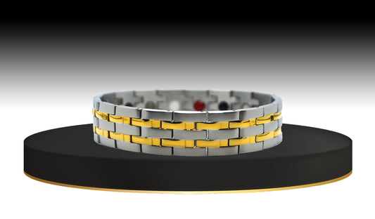 This is 'THE DYLAN,' a captivating men’s watch band bracelet that seamlessly blends potent healing properties with classic elegance. The main view showcases the unique two-tone design, where rich gold trim perfectly aligns on durable silver hinged links. This bracelet makes a confident statement in style, embodying modern sophistication.