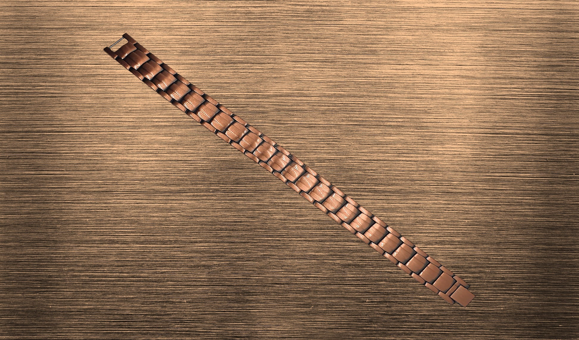 Front view of 'THE COOPER' Unisex Copper Bracelet, highlighting the intricate details of the copper links and the symbolic representation of attracting wealth and fortune. This perspective emphasizes the bracelet's unique blend of traditional symbolism and modern healing technology, creating a distinctive accessory for both men and women.