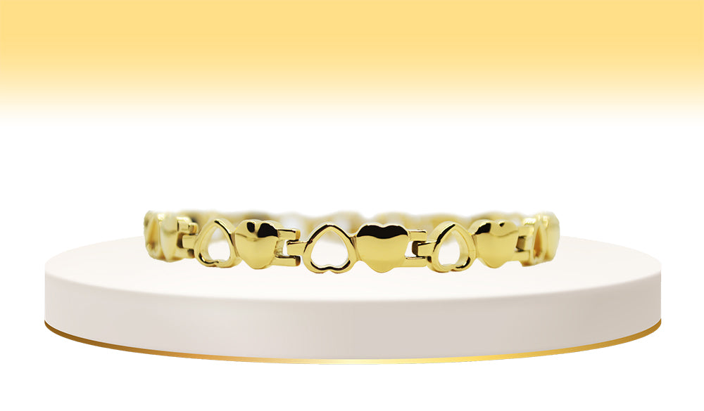 Main view of 'THE CATALINA' Women’s Gold Motif Hearts Bracelet, an embodiment of love and sophistication. This bracelet features a captivating motif of hearts meticulously crafted into the gold bar links, creating a timeless and elegant accessory that adds a touch of glamour to any ensemble.