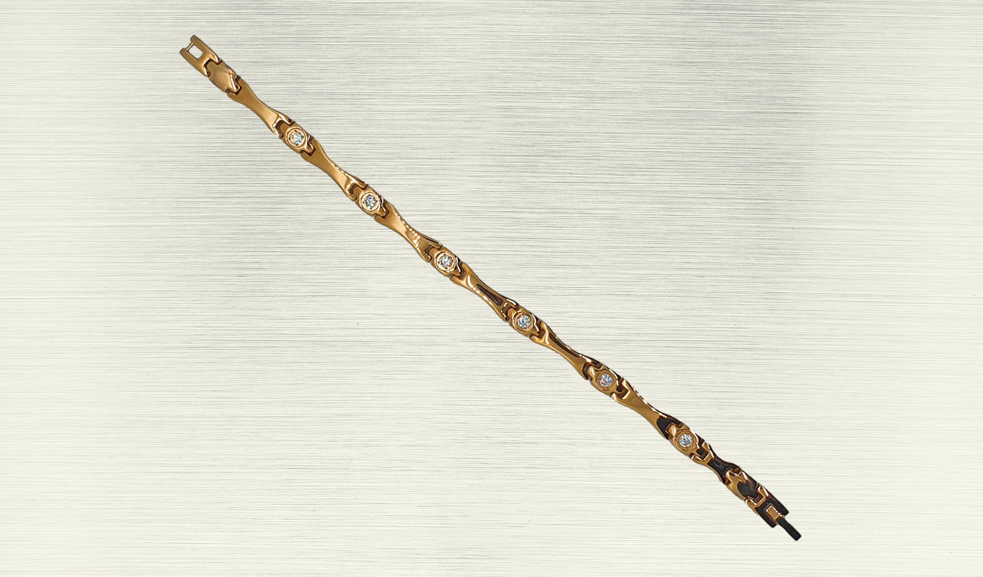 Front view of 'THE ALAIA' Women’s Rose Gold Crystallized Elongated Bracelet, highlighting the intricate details of the elongated bar design embellished with brilliant crystals. The rose gold links, polished to perfection, contribute to the bracelet's glamorous appeal. This view emphasizes the beauty and sophistication that make 'THE ALAIA' a standout accessory for women.