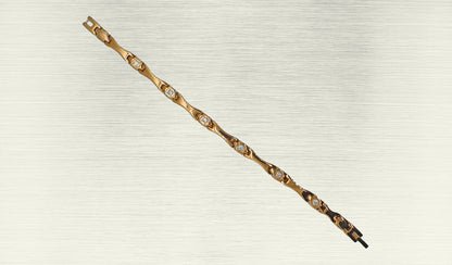 Front view of 'THE ALAIA' Women’s Rose Gold Crystallized Elongated Bracelet, highlighting the intricate details of the elongated bar design embellished with brilliant crystals. The rose gold links, polished to perfection, contribute to the bracelet's glamorous appeal. This view emphasizes the beauty and sophistication that make 'THE ALAIA' a standout accessory for women.