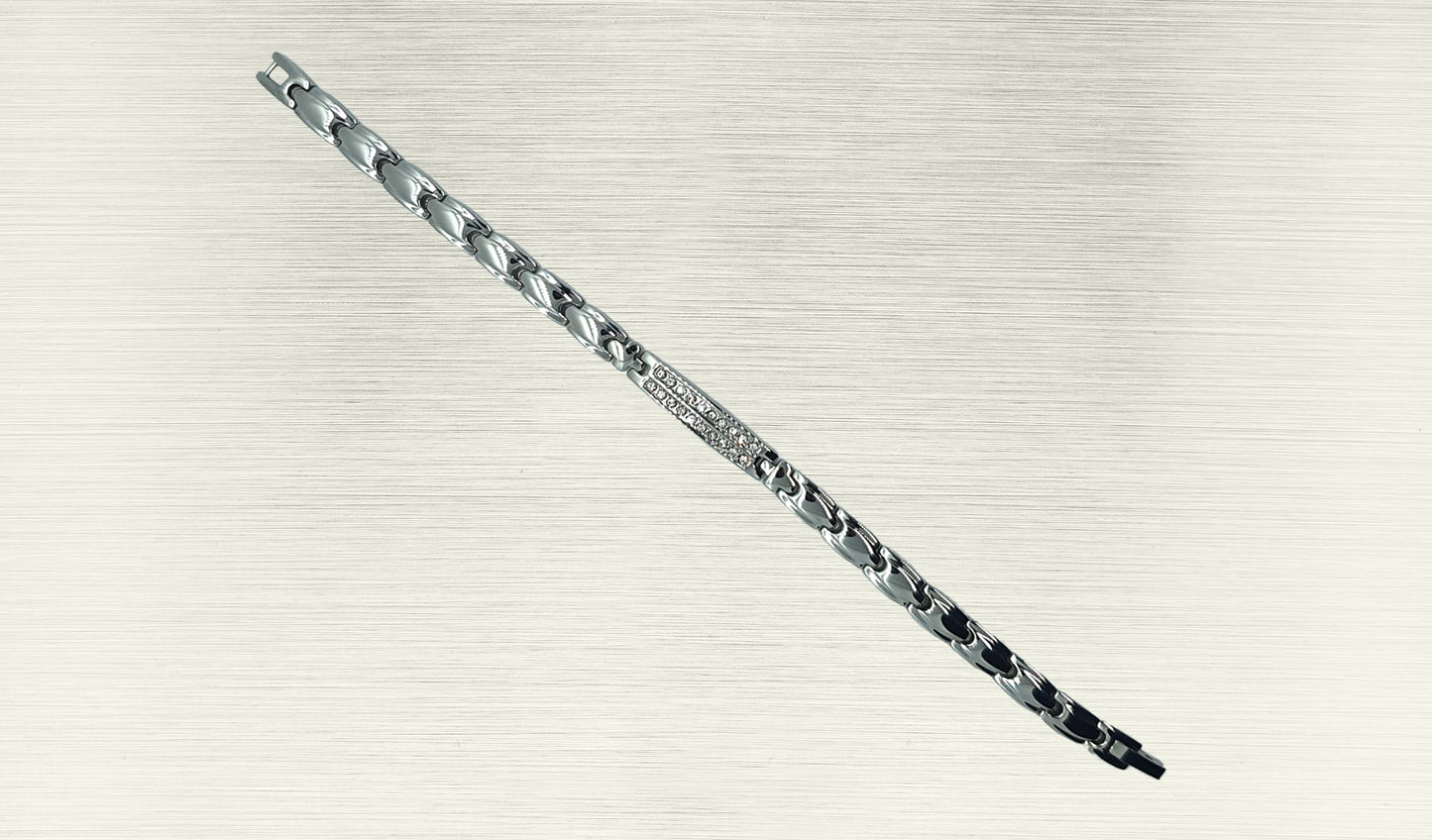 Front view of 'THE IRIS' Women’s Silver Double Bar Crystallized Bracelet, highlighting the intricate details of the round brilliant cut crystals on the bar top. The ultra-shiny silver links align along the wrist, creating a visually stunning accessory that seamlessly blends glamour with innovative technology.