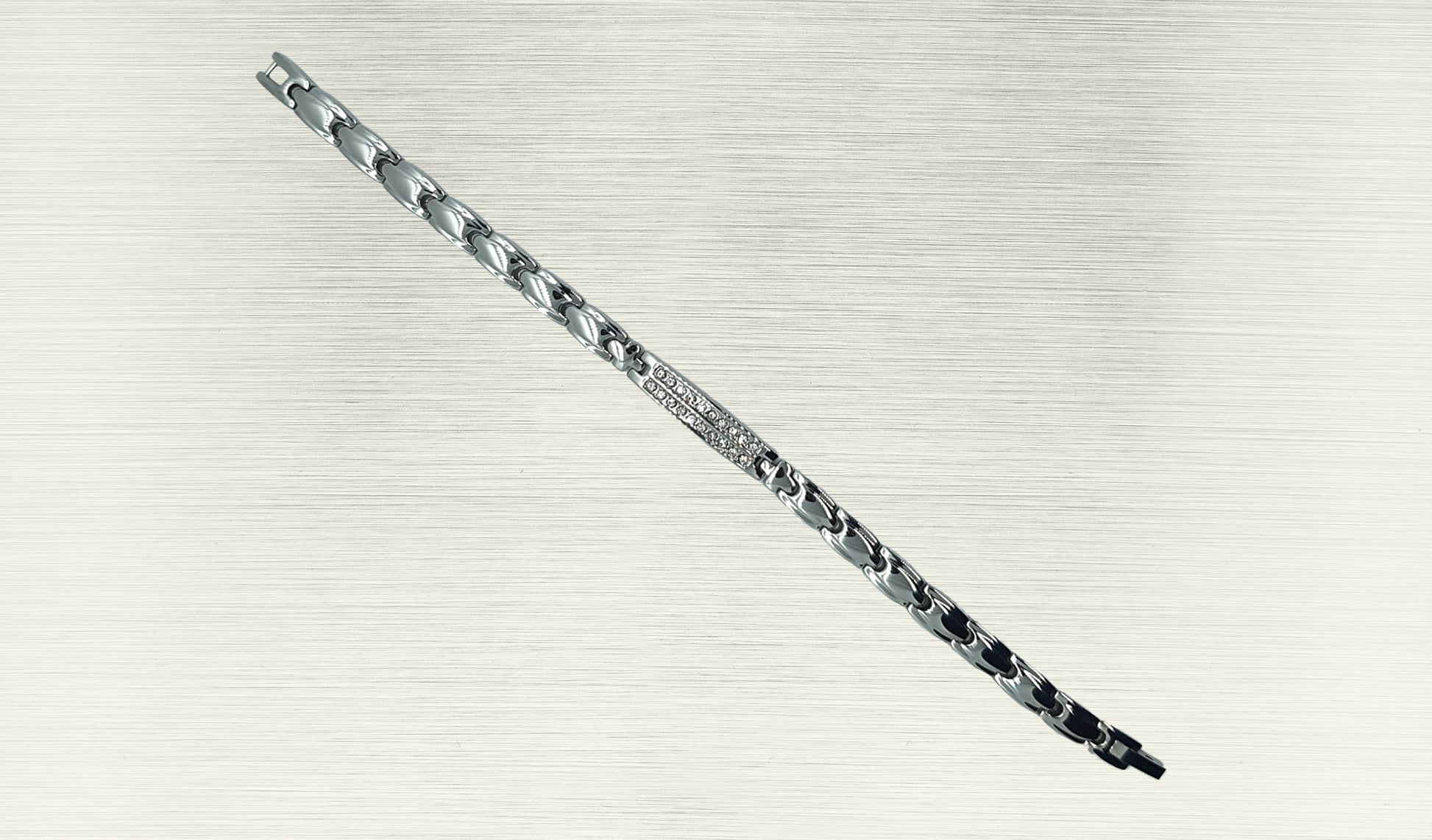 Front view of 'THE IRIS' Women’s Silver Double Bar Crystallized Bracelet, highlighting the intricate details of the round brilliant cut crystals on the bar top. The ultra-shiny silver links align along the wrist, creating a visually stunning accessory that seamlessly blends glamour with innovative technology.