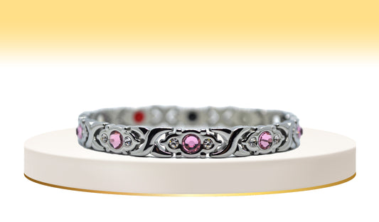 Main view of 'THE SOPHIA' Women’s Silver Pink Crystallized Filigree Bracelet, an embodiment of delicate beauty and glamour. This bracelet features intricately crafted filigree links adorned with sparkling pink crystals, creating a captivating and elegant accessory that adds a touch of sophistication to any ensemble.