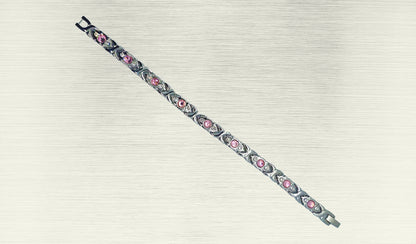 Front view of 'THE SOPHIA' Women’s Silver Pink Crystallized Filigree Bracelet, highlighting the intricate details of the filigree links adorned with sparkling pink crystals. The polished silver links add a radiant glow, enhancing the overall allure of this romantic design. This view emphasizes the captivating beauty that makes 'THE SOPHIA' a distinctive and chic addition to your jewelry collection.